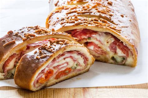 Stromboli pizza - Made with 12" pizza dough and served with a side of pizza sauce. Pick 3 toppings to build a custom stromboli and make it your own. Additional toppings charge applies. 